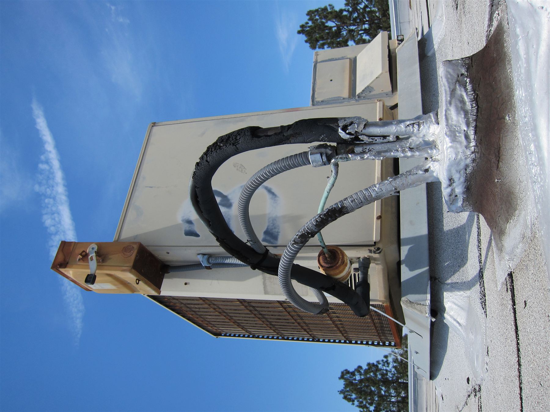 A rooftop split-system condenser unit by All Counties Refrigeration, LLC, Carson City