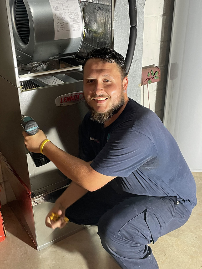 Servicing an outdoor AC condenser unit by All Counties Refrigeration, LLC, Carson City